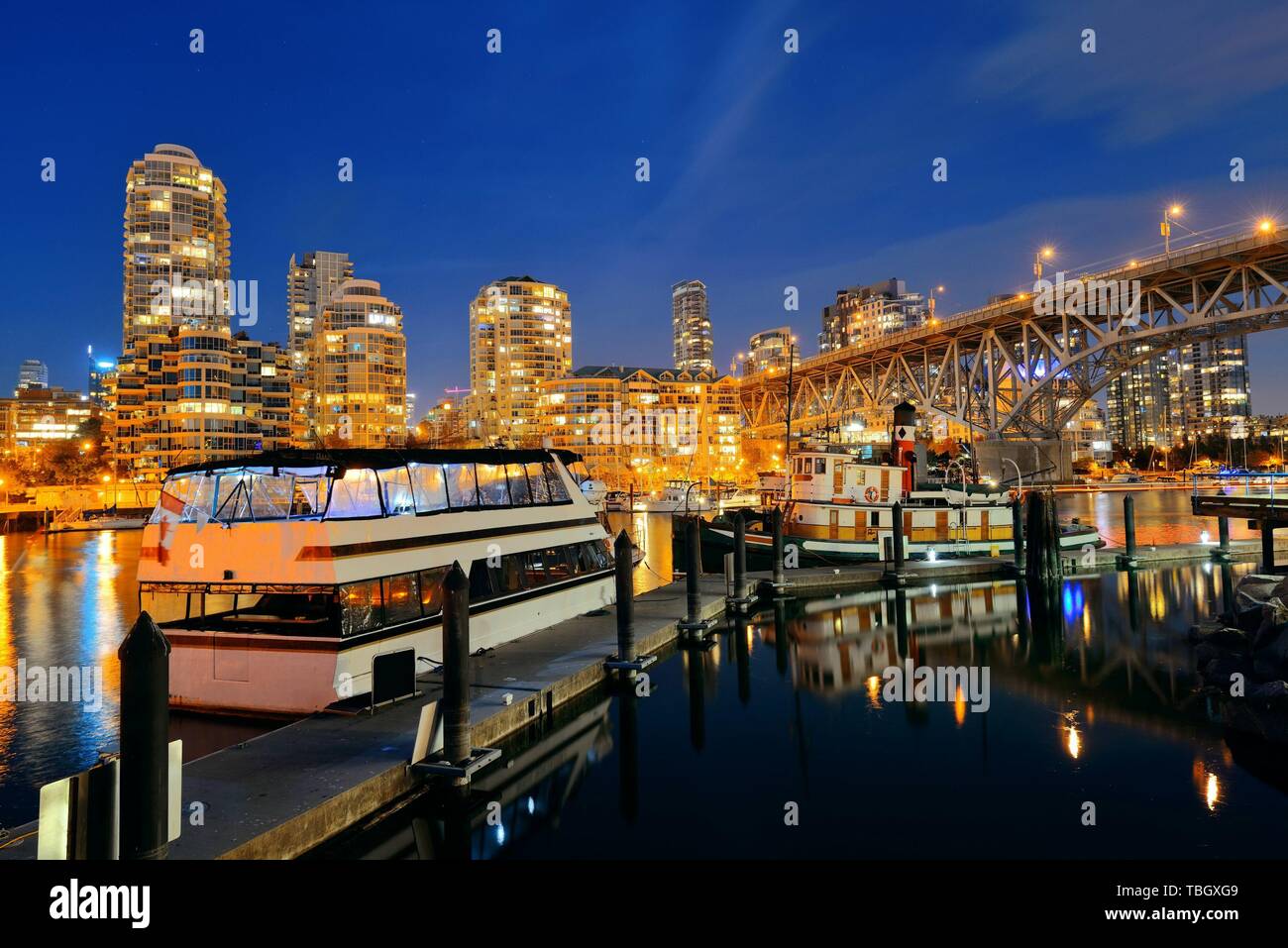 Vancouver False Creek at night with bridge and boat Stock Photo - Alamy