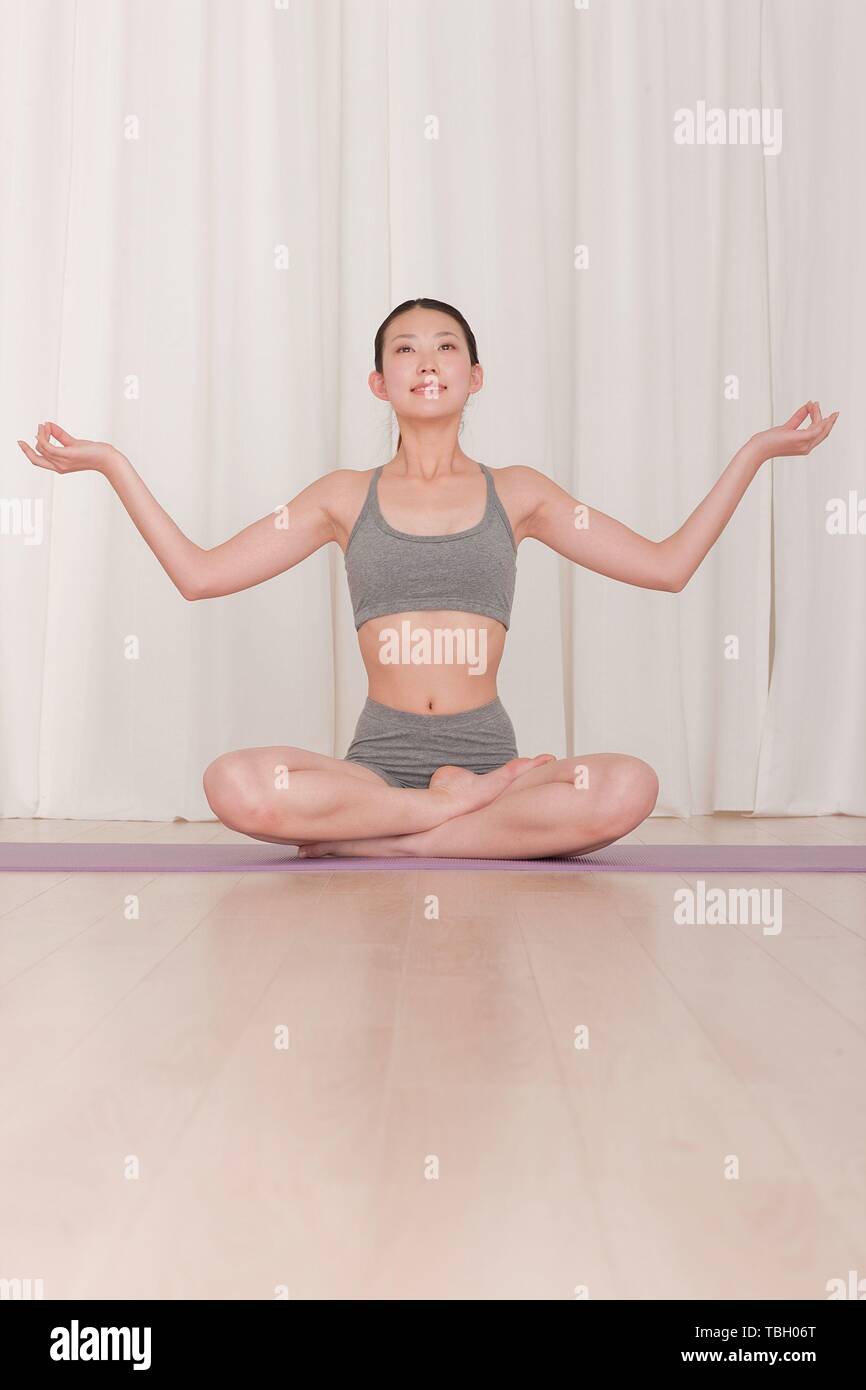 Young asian man raised hi-res stock photography and images - Alamy