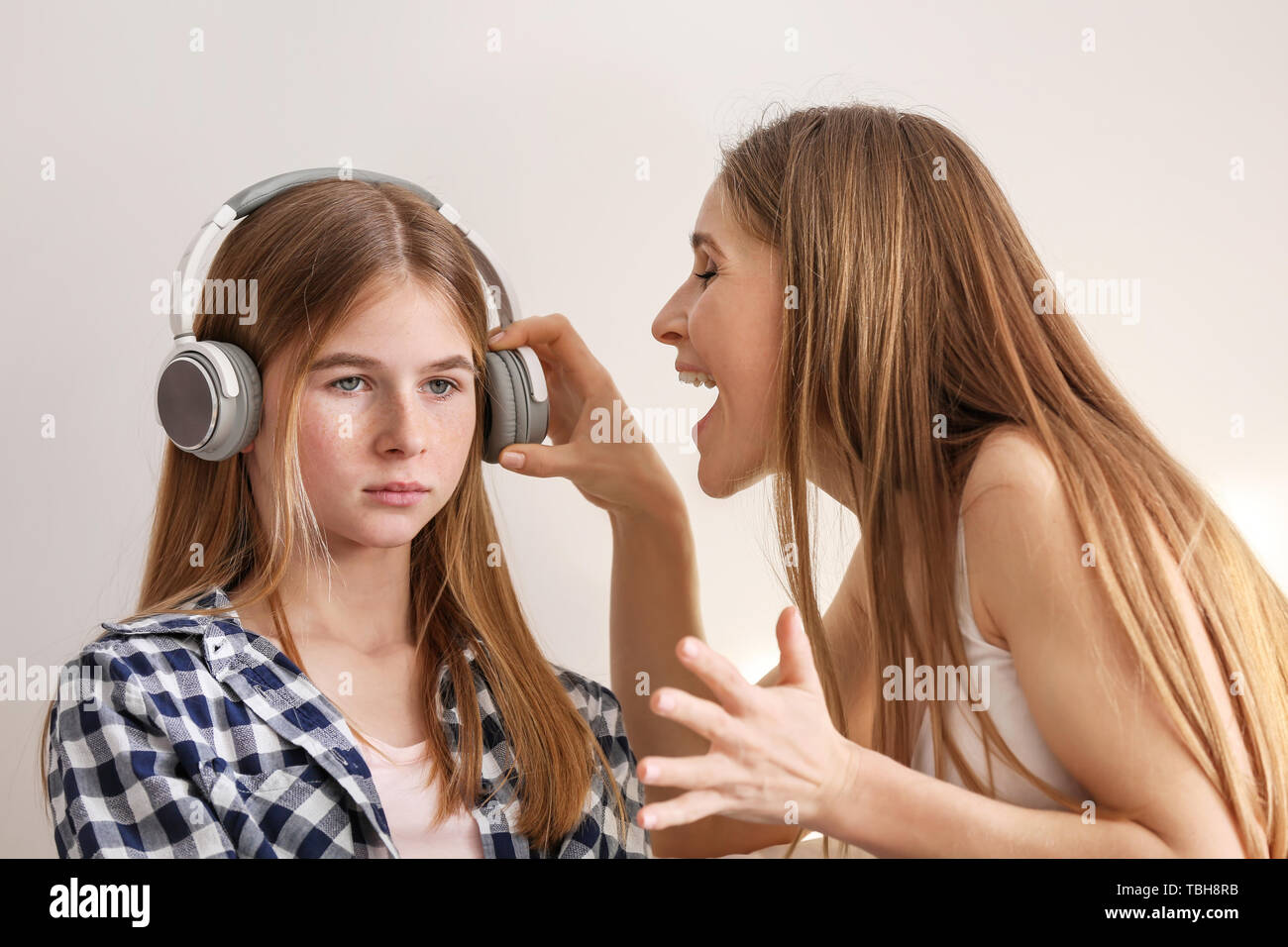 Sad teenage girl having argument with her mother Stock Photo