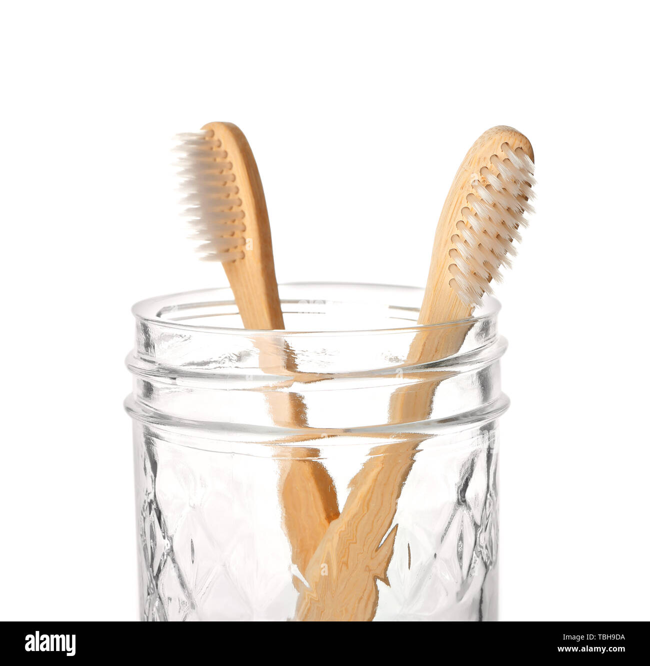 Holder with toothbrushes on white background Stock Photo - Alamy