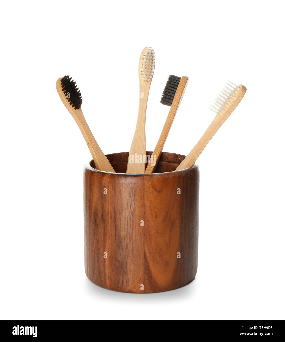 Holder with toothbrushes on white background Stock Photo - Alamy
