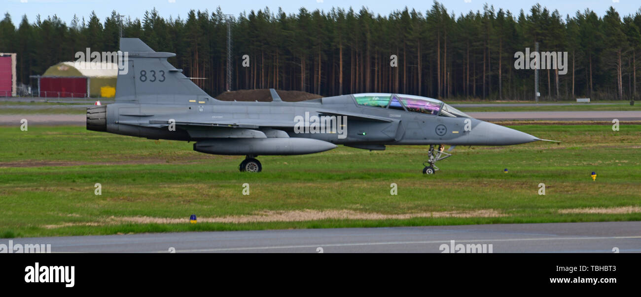 A Swedish Air Force JAS 39 Gripen taxis after flight operations in support of Arctic Challenge Exercise 2019 at Kallax Air Base, Luleå, Sweden, May 30, 2019. ACE 19 is a Nordic aviation exercise that provides realistic, scenario-based training to prepare forces for enemy defensive systems. U.S. forces are engaged, postured and ready to deter and defend in an increasingly complex security environment. (U.S. Navy Photo by Chief Mass Communication Specialist John M. Hageman) Stock Photo