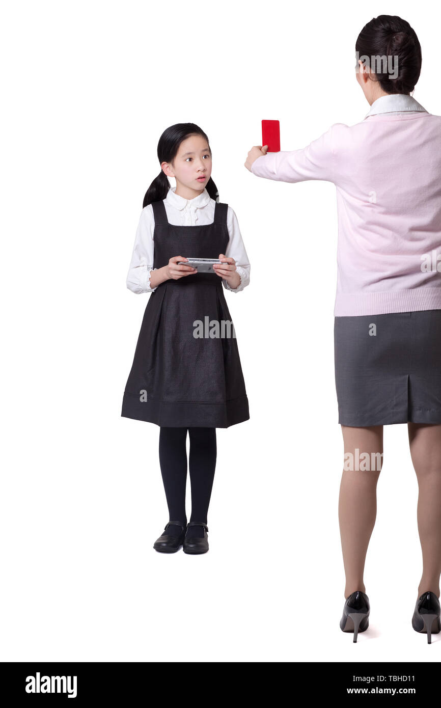 Mother forces daughter not to play games Stock Photo