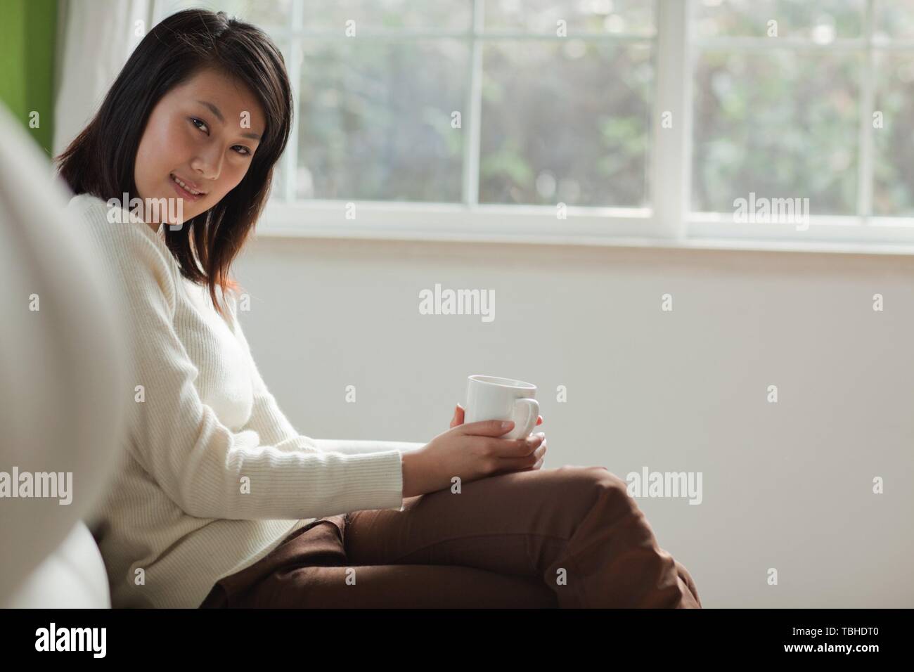 Young asian man woman sitting hi-res stock photography and images - Alamy