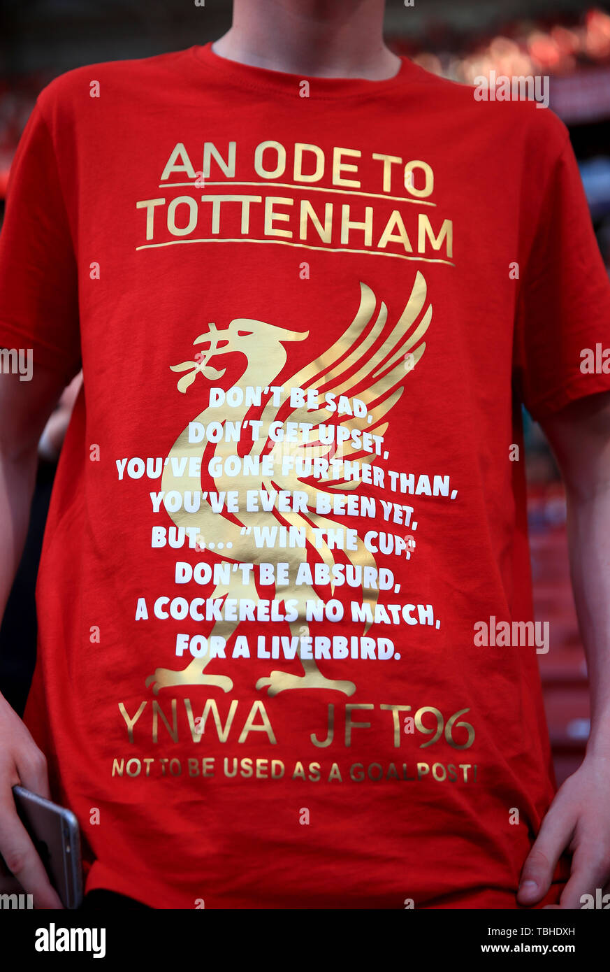 A Liverpool fan with a t-shirt aimed at the Tottenham Hotspur fans before the UEFA Champions League Final at the Wanda Metropolitano, Madrid Stock Photo - Alamy