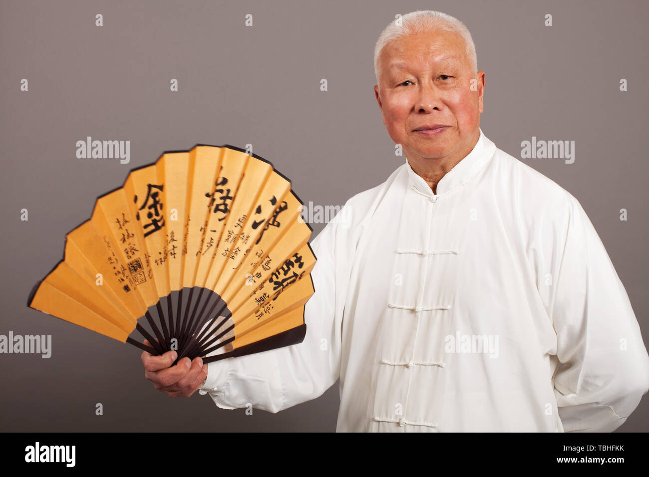 An old man in a traditional costume. Stock Photo
