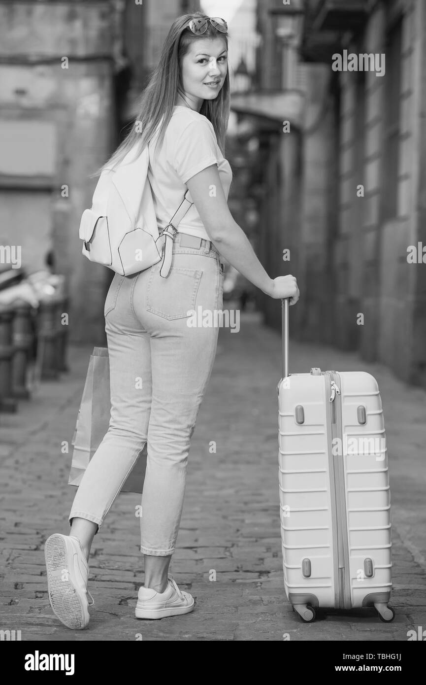 happy young tourist  taking   walk in  city with the travel bag Stock Photo