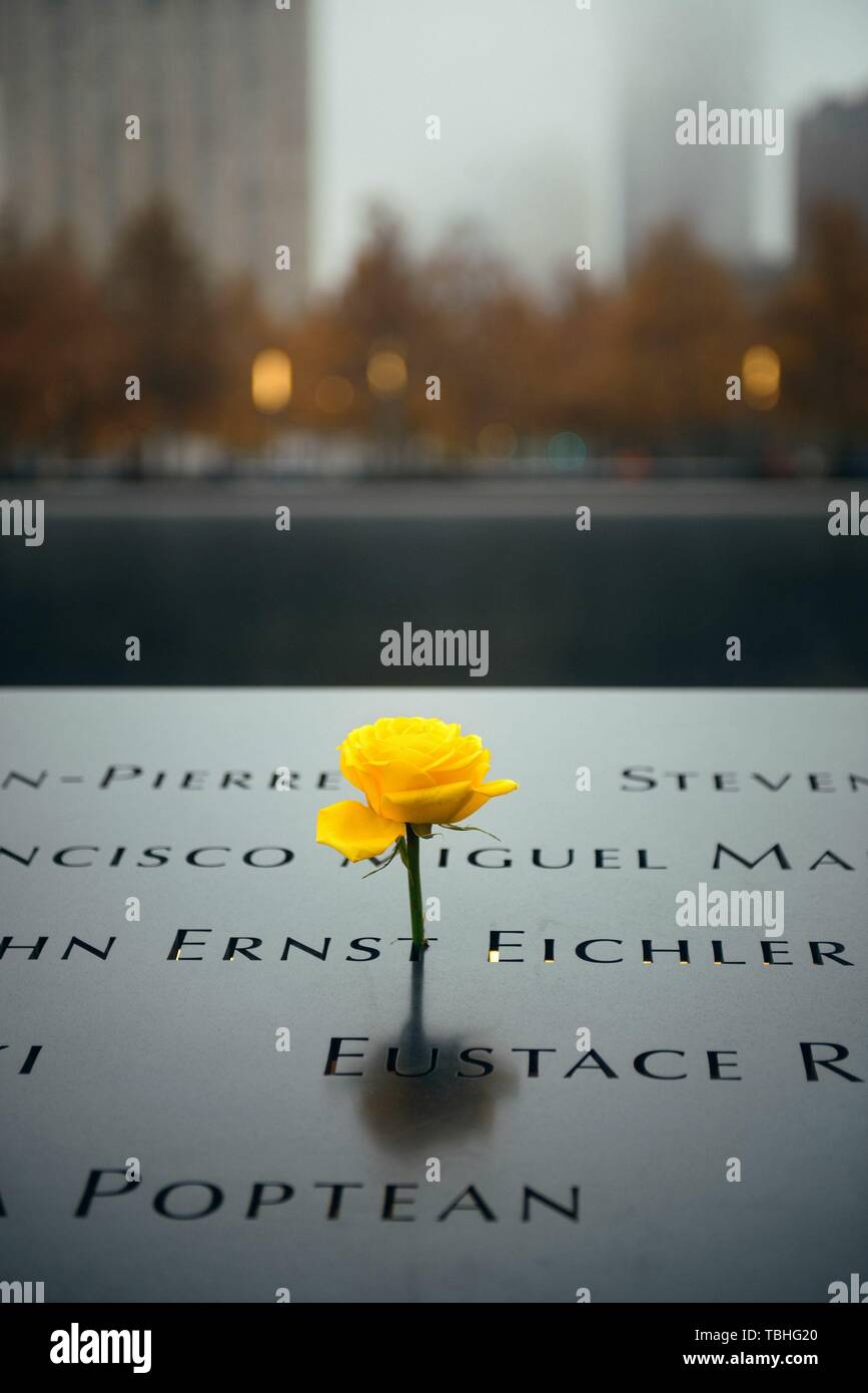 NEW YORK CITY - NOV 12: September 11 memorial in a foggy day on November 12, 2014 in Manhattan, New York City. With population of 8.4M, it is the most populous city in the United States. Stock Photo
