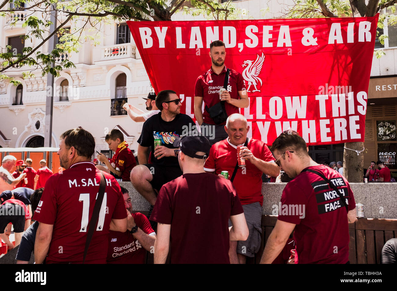 Liverpool fans next to a banner at the fan zone. Madrid hosts the UEFA Champions League Final between Liverpool and Tottenham Hotspur at the Wanda Metropolitano Stadium. Stock Photo
