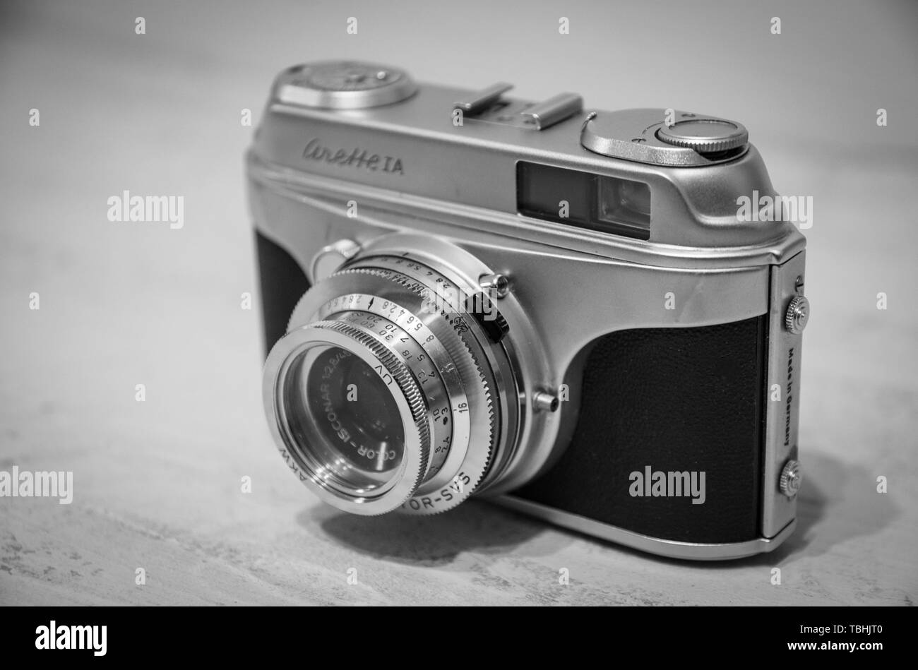 An old blank and white film camera on a plain background Stock Photo ...