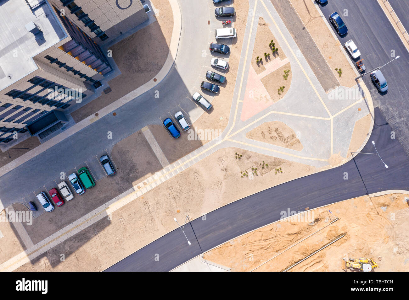 aerial top view of street with parking lot near new residential housing complex Stock Photo