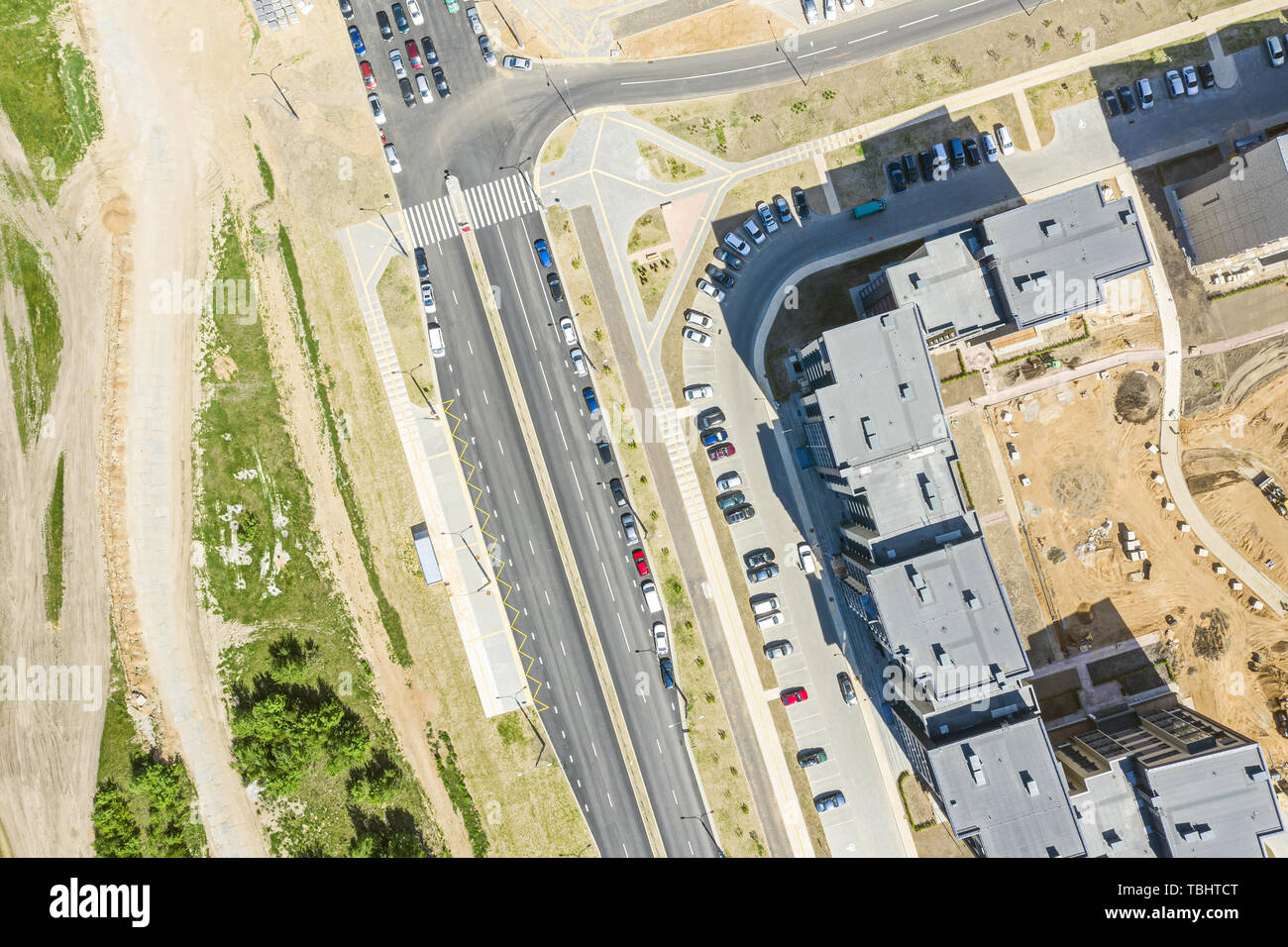 aerial top view of street with parked cars near new residential housing complex Stock Photo