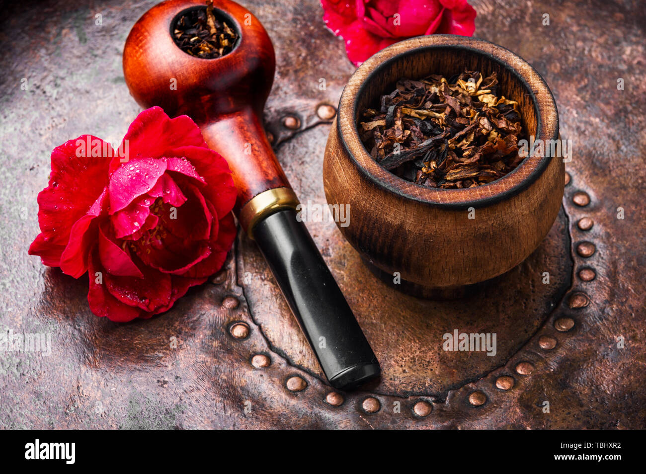 Tobacco pipe and smoking tobacco with rose flavor.Refined taste of
