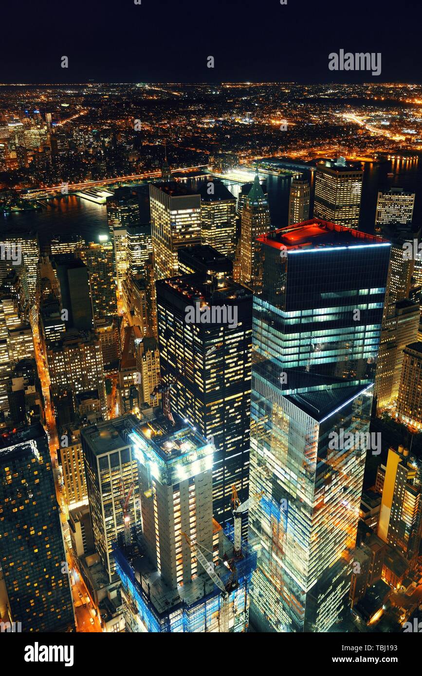 Rooftop night view of New York City downtown with urban skyscrapers ...
