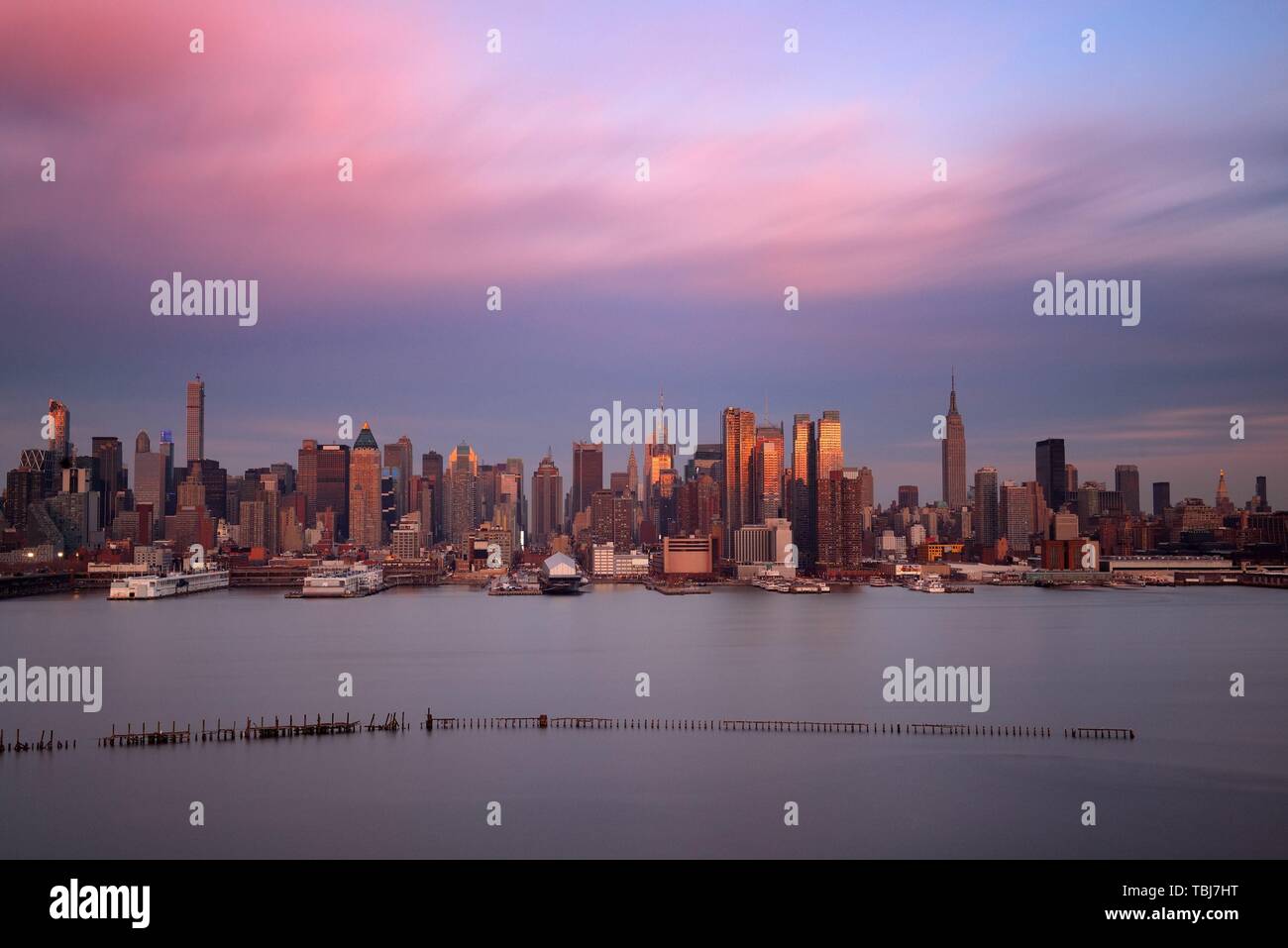 Midtown skyline over Hudson River in New York City with skyscrapers at ...