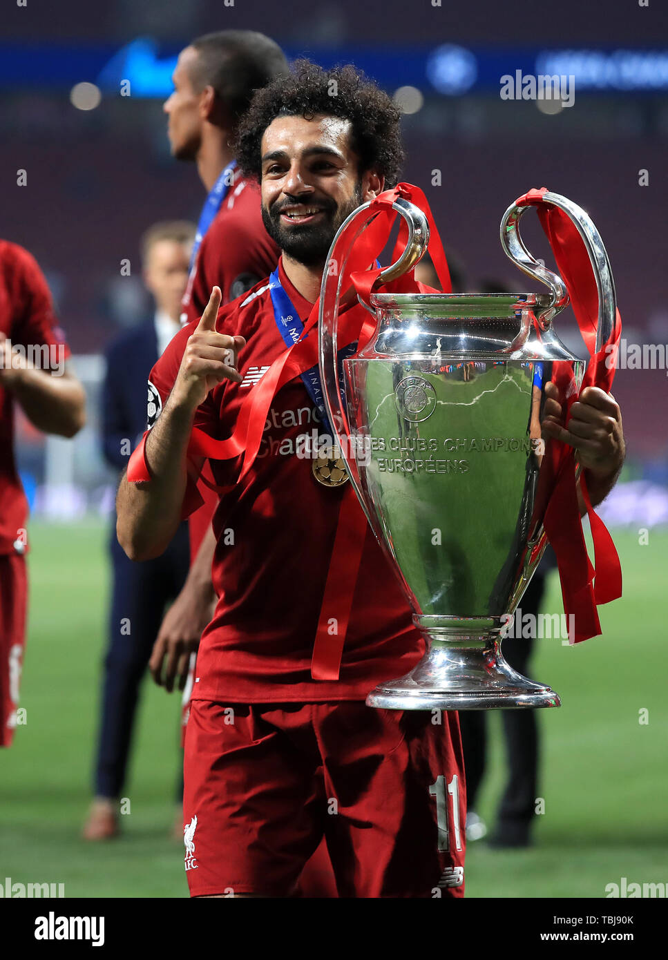 Liverpool's Mohamed Salah celebrates with the trophy after winning the