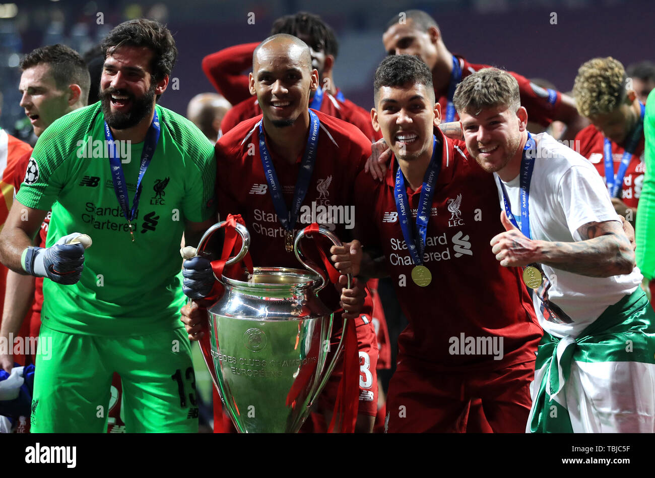 Liverpool S Left Right Alisson Fabinho Roberto Firminho And Alberto Moreno Lift The Trophy After The Final Whistle During The Uefa Champions League Final At The Wanda Metropolitano Madrid Stock Photo Alamy