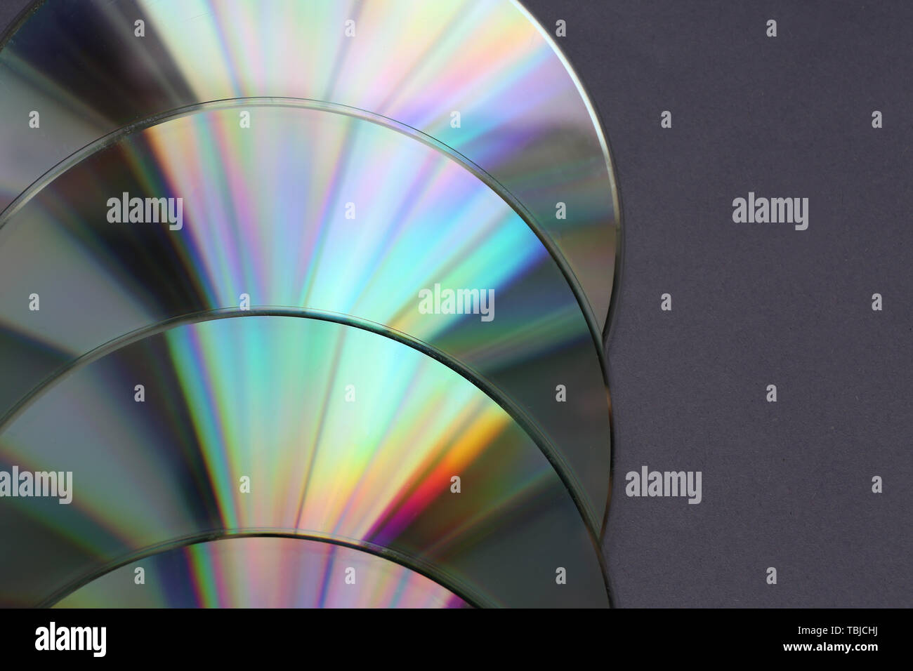 Shiny compact disks on dark background, closeup Stock Photo