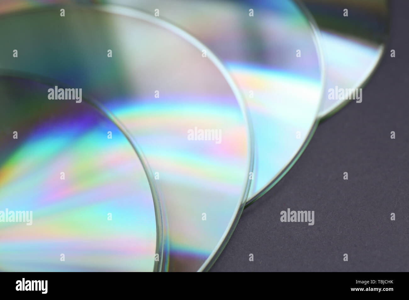 Shiny compact disks on dark background, closeup Stock Photo