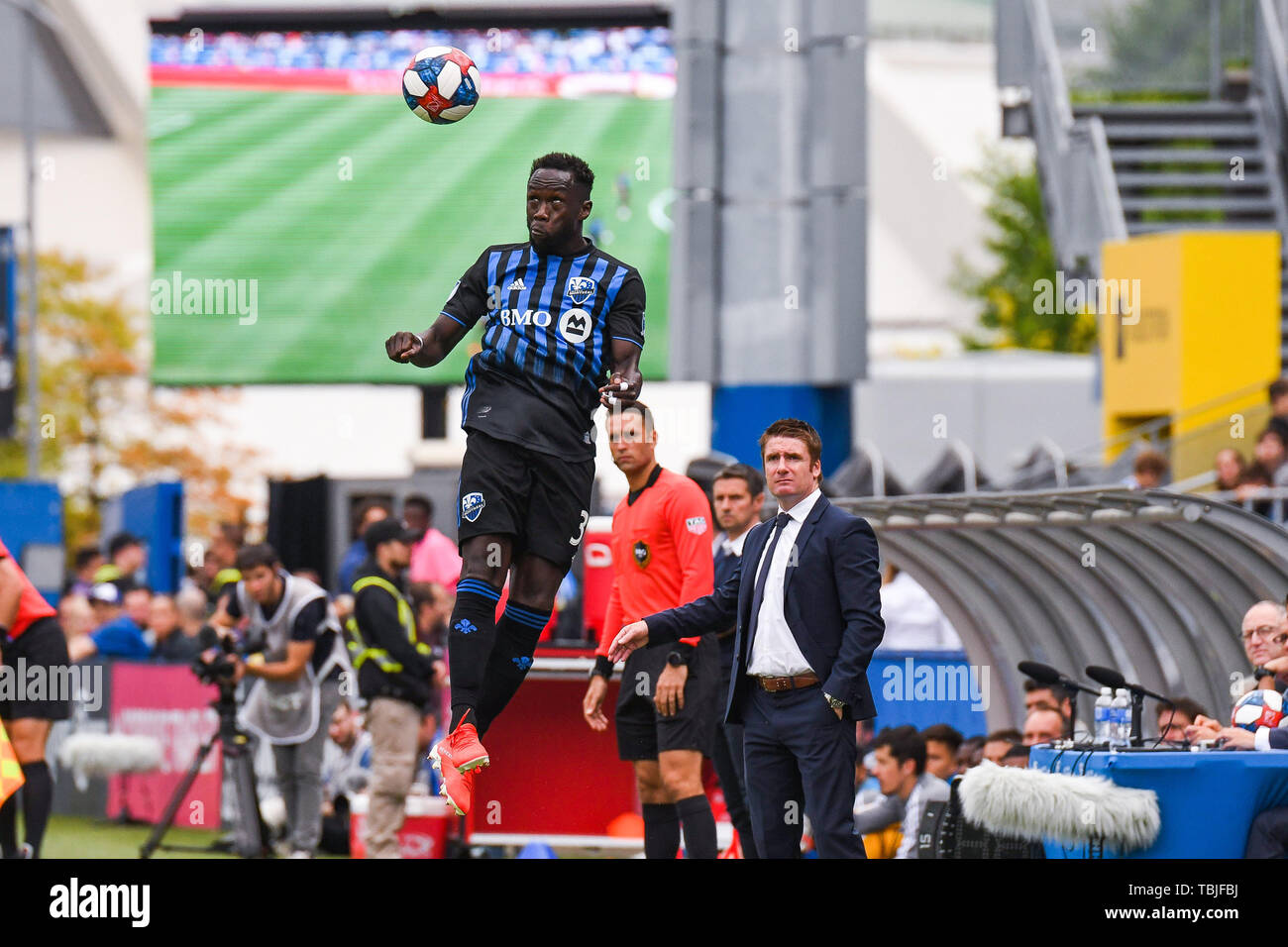 Montreal, Canada. 01st June, 2019. Montreal Impact defender Bacary Sagna (33) hits the ball with his head jumping in the air during Orlando City SC at Montreal Impact game at Saputo Stadium in Montreal, Canada. David Kirouac/CSM/Alamy Live News Stock Photo