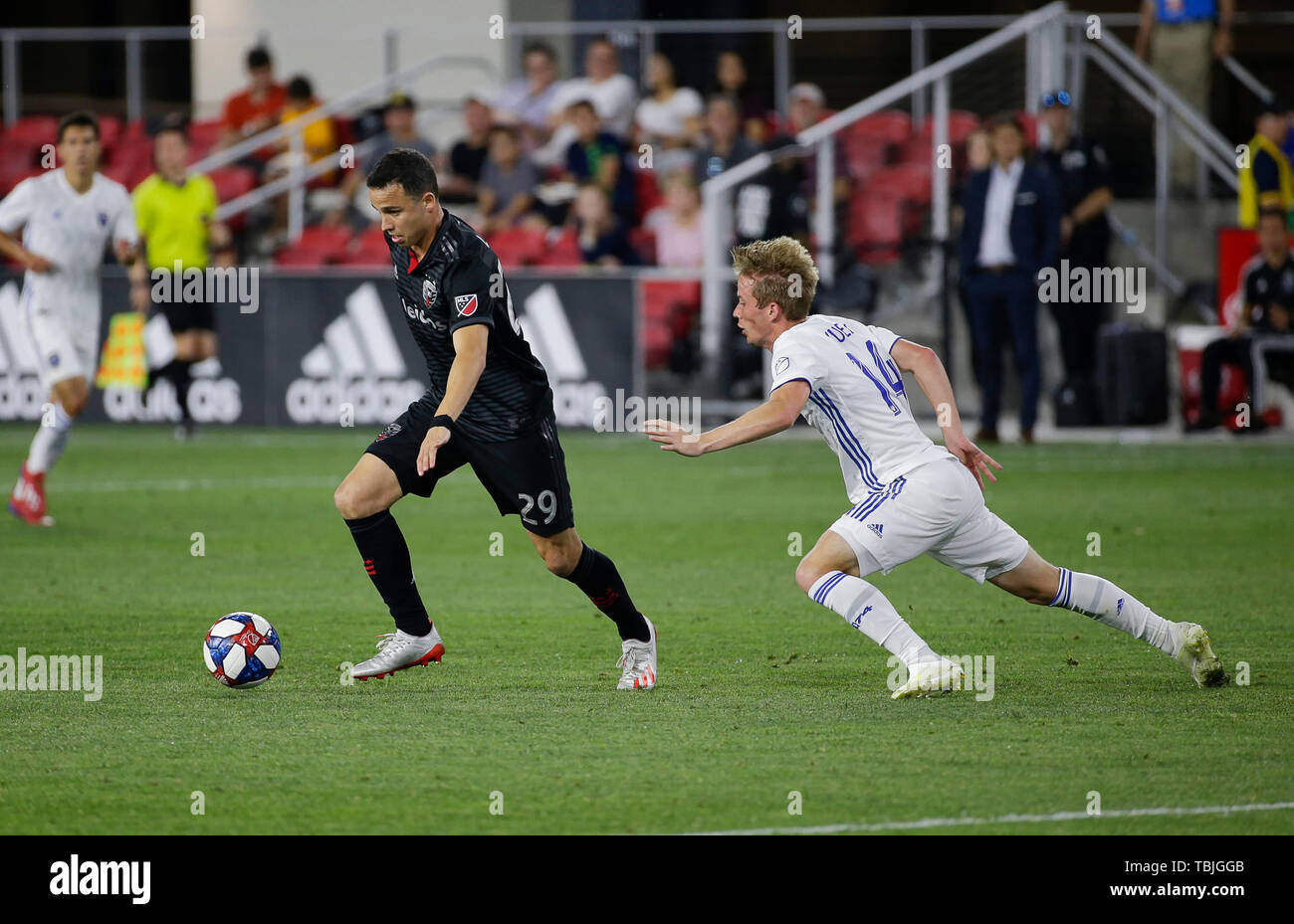 Washington DC, USA. 1st June, 2019. San Jose Earthquakes Midfielder (14) Jackson Yueill loses his footing as he tries to defend D.C. United Midfielder (29) Leonardo Jara during an MLS soccer match between the D.C. United and the San Jose Earthquakes at Audi Field in Washington DC. Justin Cooper/CSM/Alamy Live News Stock Photo