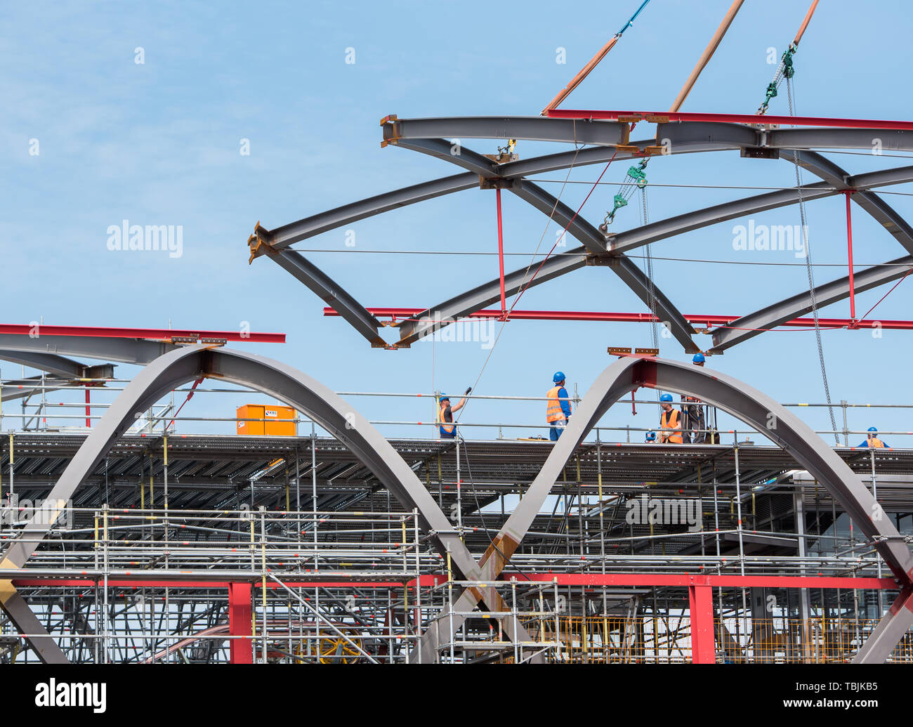 Hamburg, Germany. 02nd June, 2019. With the help of cranes, a component is  being used on the construction site of the future "Elbbrücken" S-Bahn  station. The approximately 50 ton steel structure is
