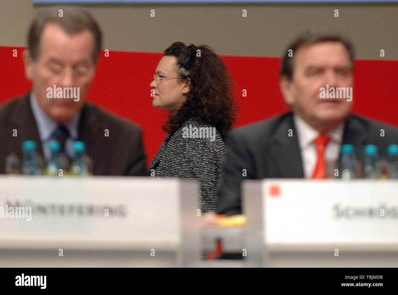 Karlsruhe, Germany. 14th Nov, 2005. Andrea Nahles (M), member of the SPD presidium, walks behind the then Federal Chancellor Gerhard Schröder (r) and the then SPD chairman Franz Müntefering at the SPD party conference. SPD party and faction leader Nahles resigns. Credit: Boris Roessler/dpa/Alamy Live News Stock Photo