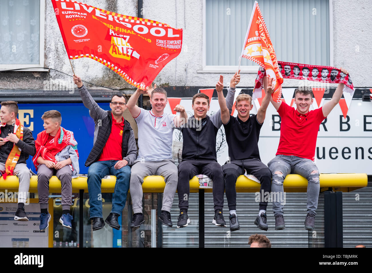 June 2, 2019: Liverpool, UK. Following their Champions League success last night, fans gather to see Liverpool Football Club parade the Champions League trophy on an open top bus through the Old Swan area of Liverpool, from there the open top bus will make its way into the city centre. Stock Photo