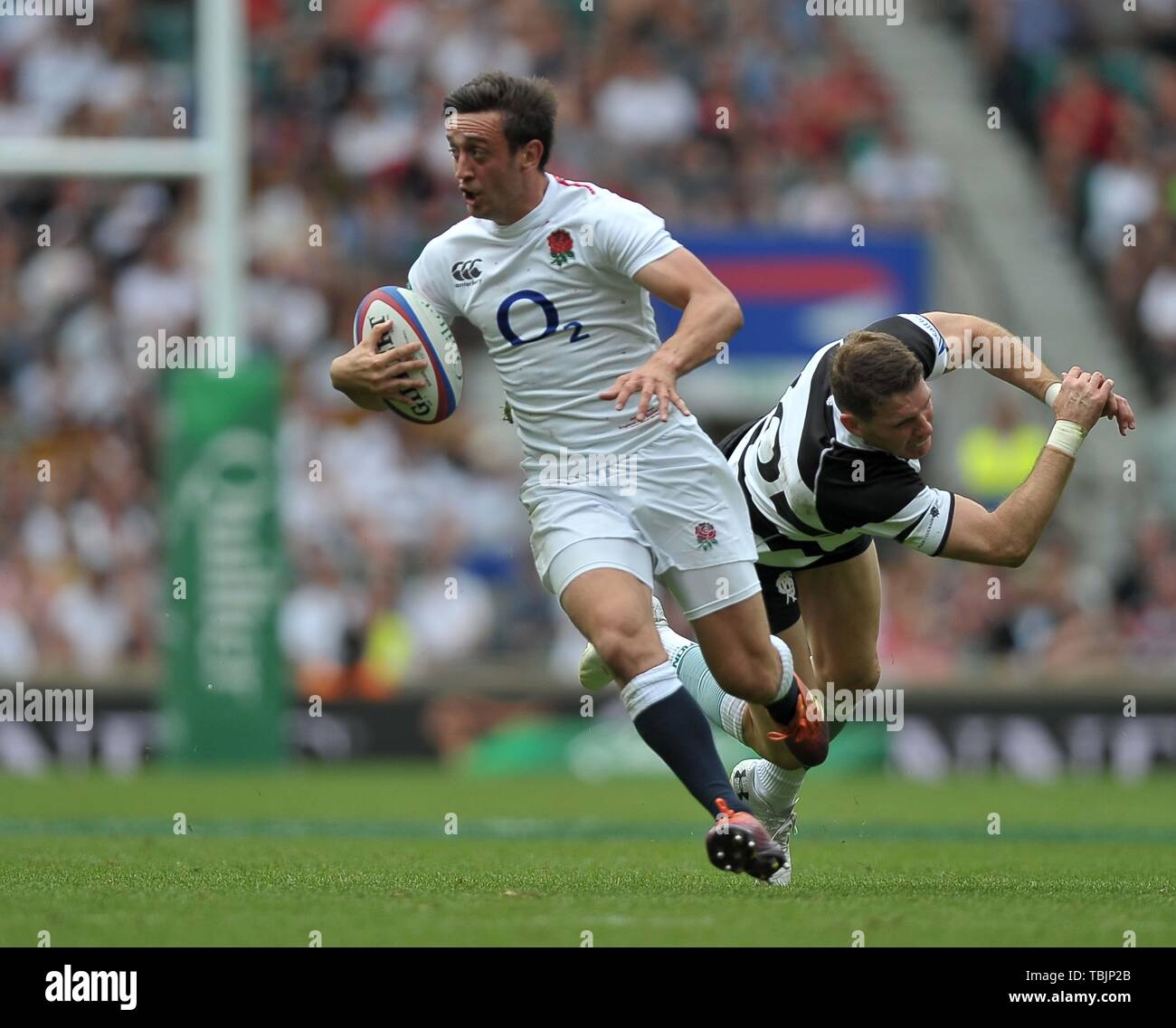 Twickenham Stadium. London. UK. 2nd June 2019. Quilter Cup. England XV v Babarians. Alex Mitchell (England) goes past Colin Slade (Babarians). 02/06/2019. Credit: Sport In Pictures/Alamy Live News Credit: Sport In Pictures/Alamy Live News Stock Photo