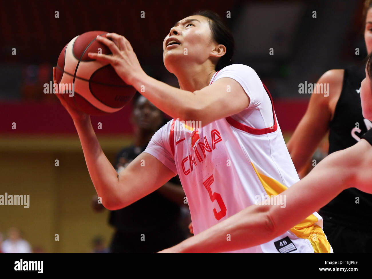 Haian, China's Jiangsu Province. 2nd June, 2019. Wang Siyu (L) of China goes for a basket during the 2019 International Women's Basketball Challenge between China and Canadian-American Women All-Stars Team in Haian, east China's Jiangsu Province, June 2, 2019. China won 92-85. Credit: Ji Chunpeng/Xinhua/Alamy Live News Stock Photo