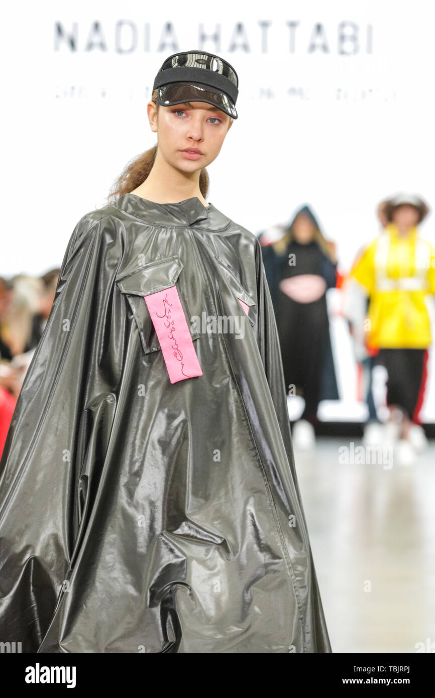 London, UK, 02 June 2019.  A model walks the runway in a design by Nadia Hattabi, Greater Brighton Metropolitain College.   Graduate Fashion week is held at the Old Truman Brewery, and a showcase and springboard for new talent from British fashion schools to the international fashion industry. Stock Photo