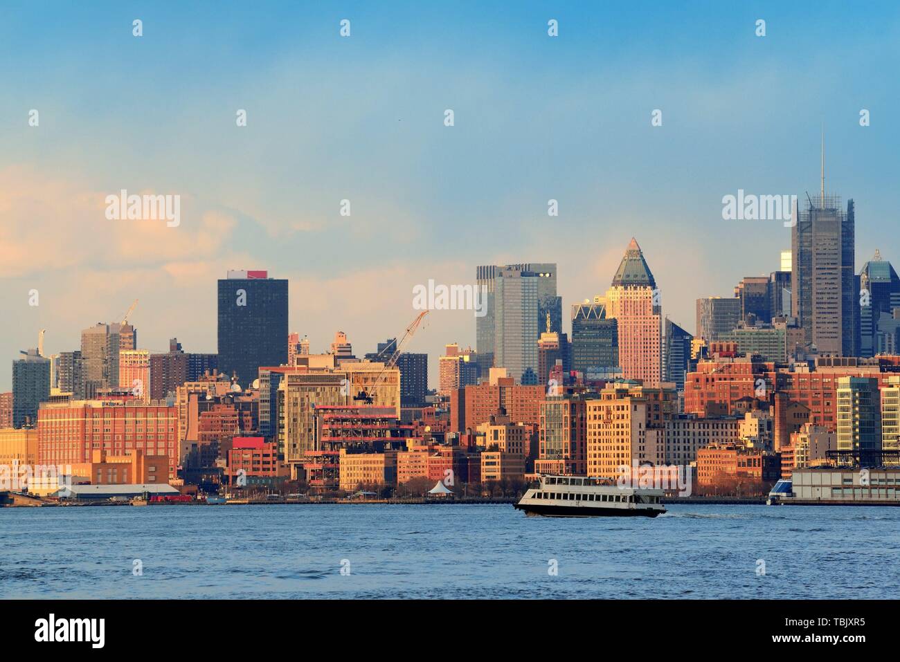 Downtown Manhattan skyline at sunset over Hudson River in New York City ...