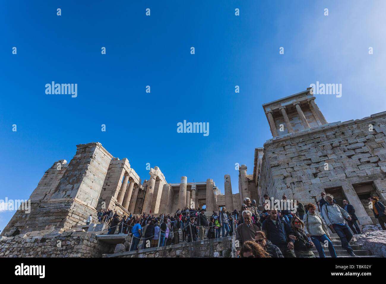 ATHENS GREECE - OCTOBER 25 2018: Tourists descending the staircase in front of the Acropolis Propylaea Stock Photo