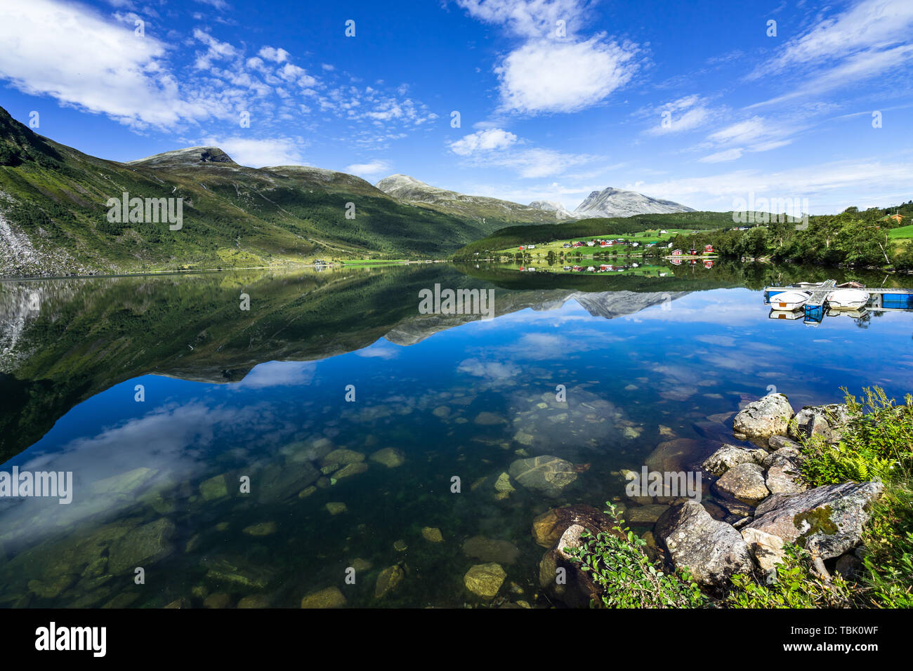 The amazing landscape of Eidsvatnet lake reflected in the water. Eidsvatnet lake is located between Geirangerfjord and Eidsdal, Norway Stock Photo