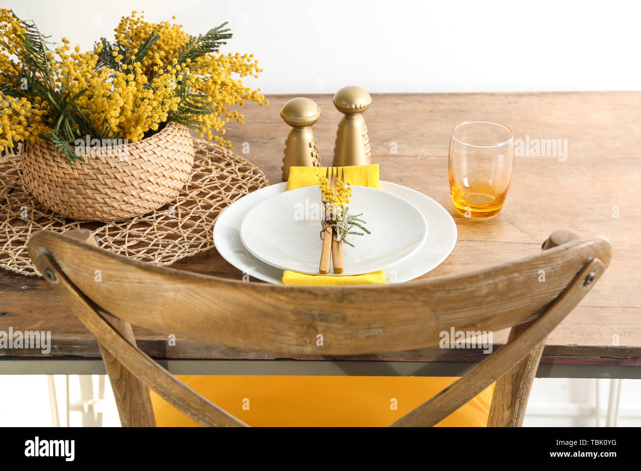 Beautiful table setting with mimosa flowers Stock Photo