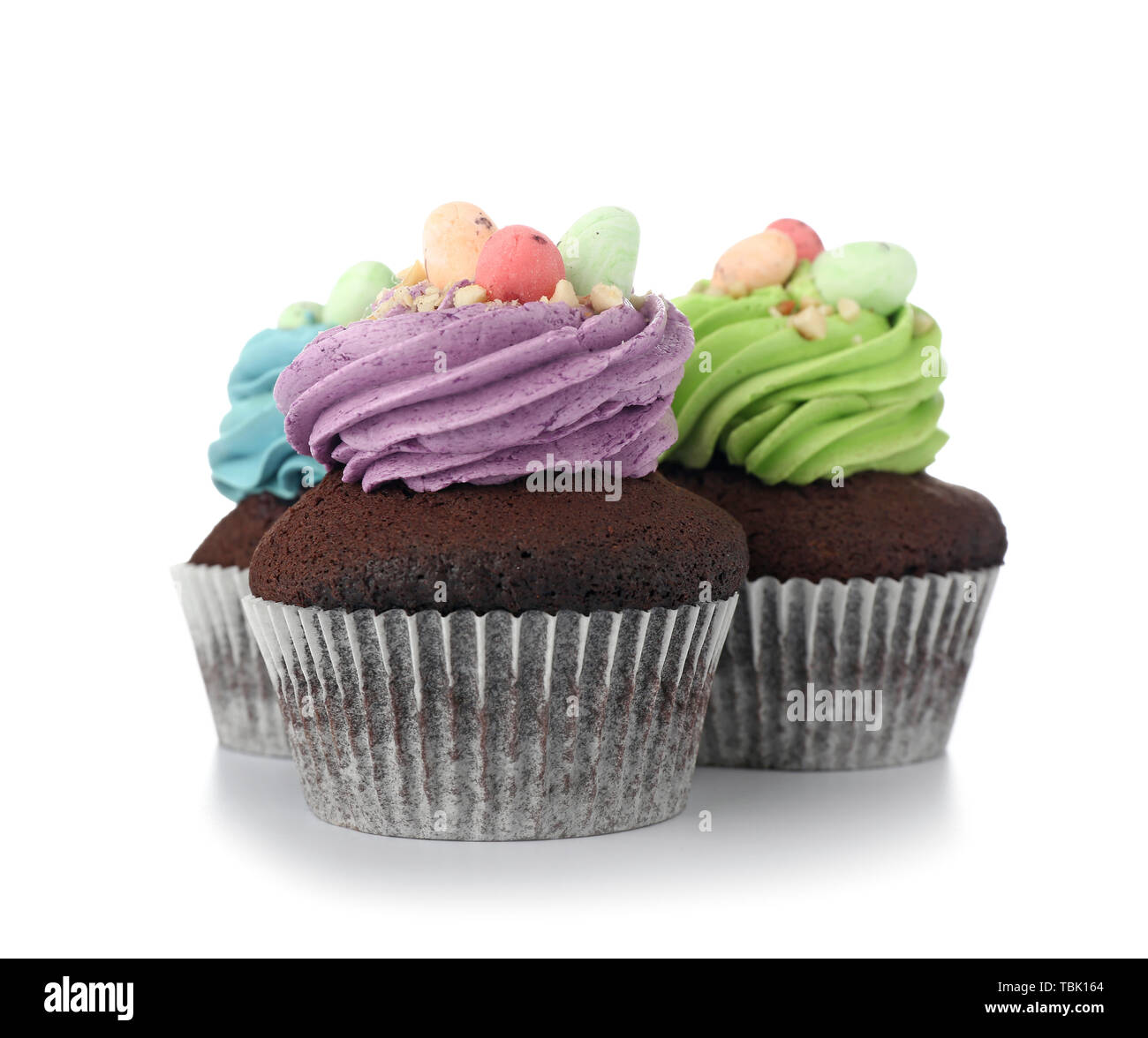 Sweet Easter cupcakes on white background Stock Photo