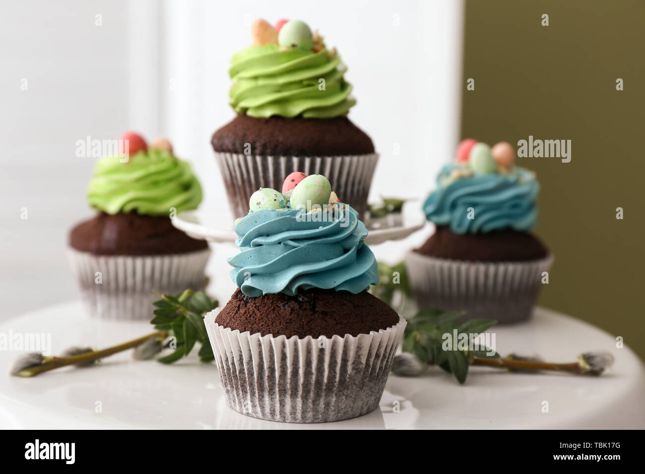 Sweet Easter cupcakes on table Stock Photo