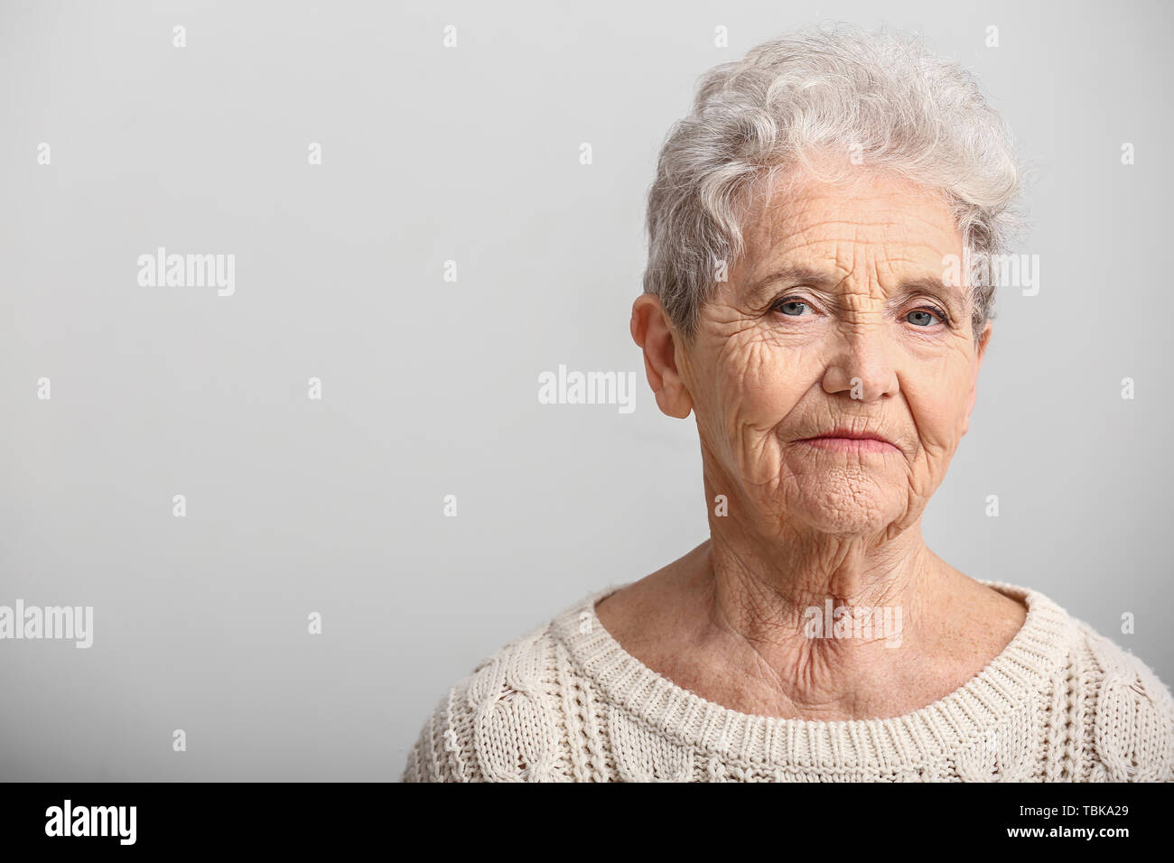 Portrait of senior woman on white background Stock Photo - Alamy