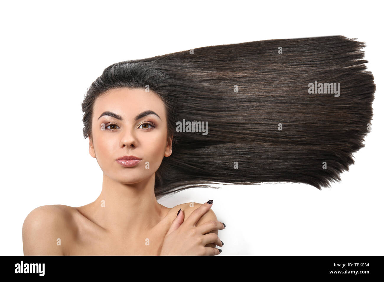 Portrait of beautiful young woman with healthy long hair on white ...