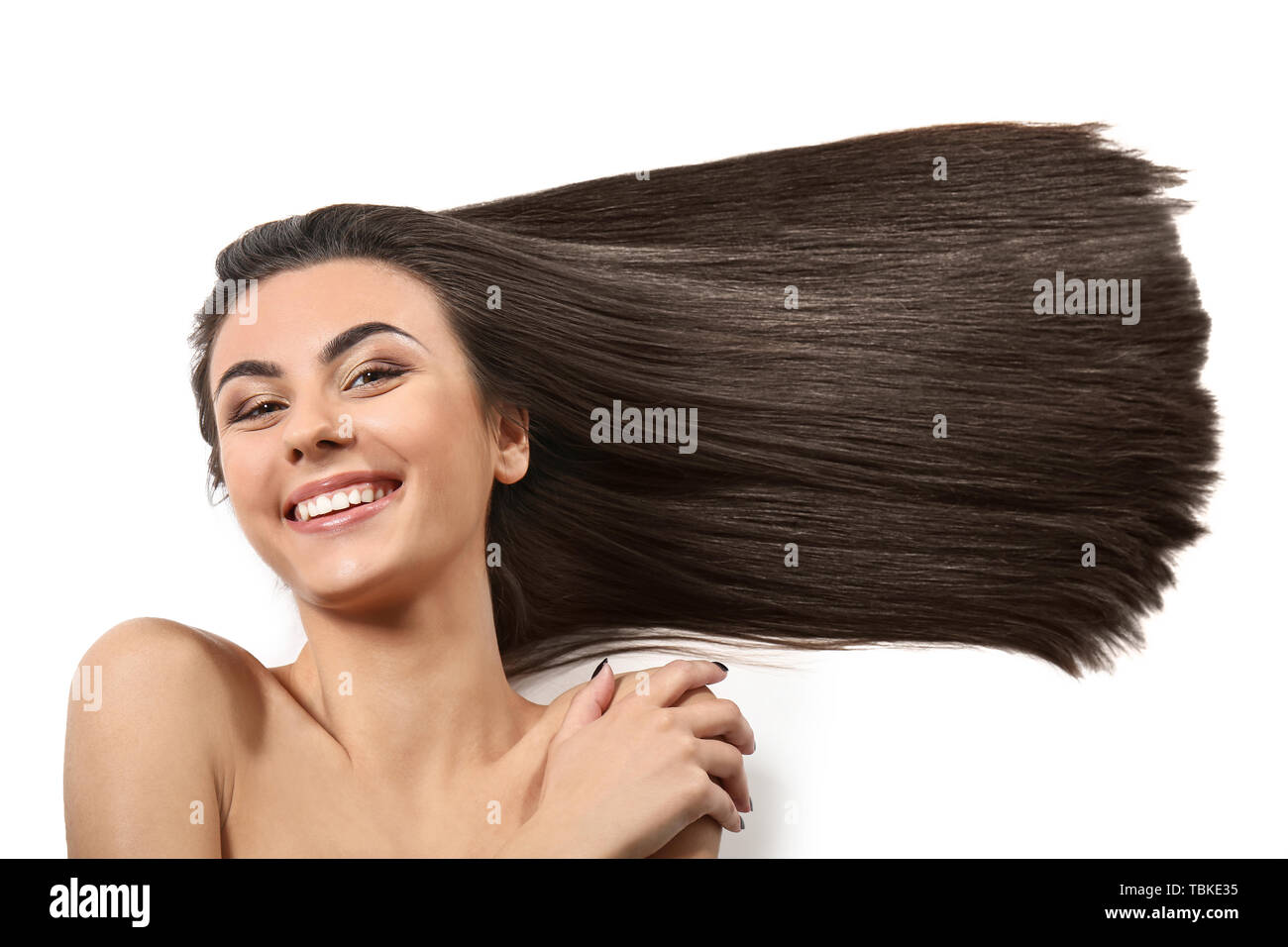 Portrait of beautiful young woman with healthy long hair on white ...