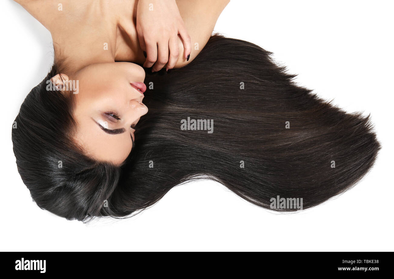 Portrait of beautiful young woman with healthy long hair on white ...
