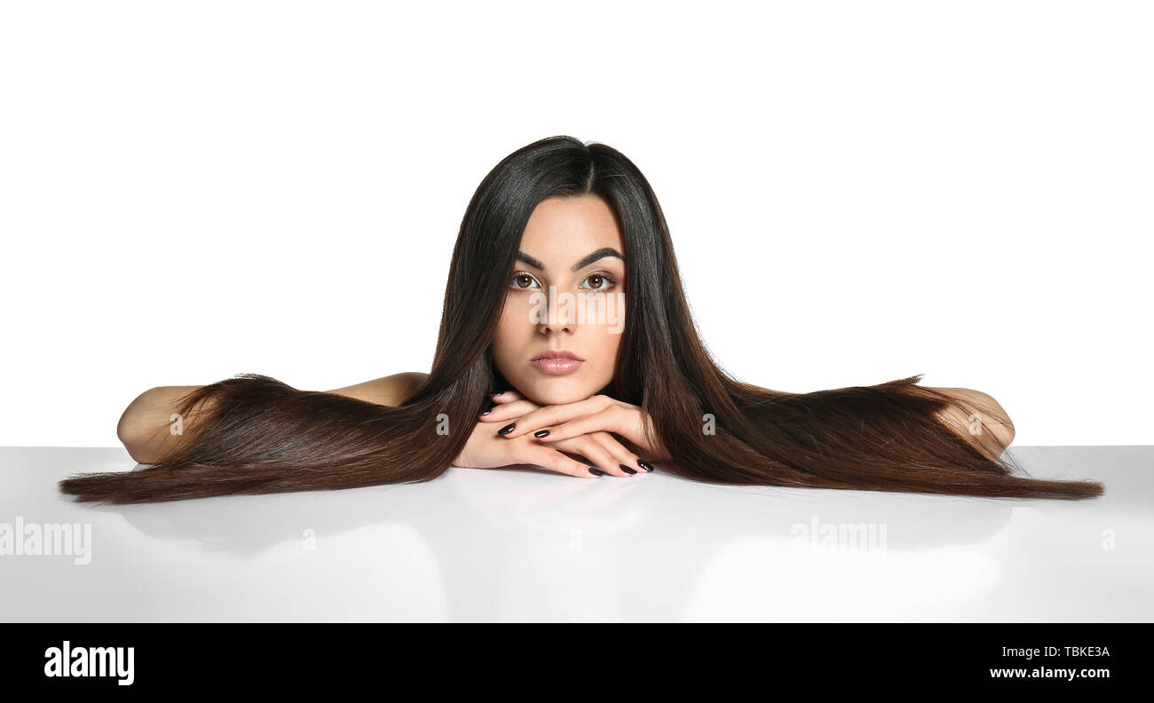 Portrait of beautiful young woman with healthy long hair on white ...