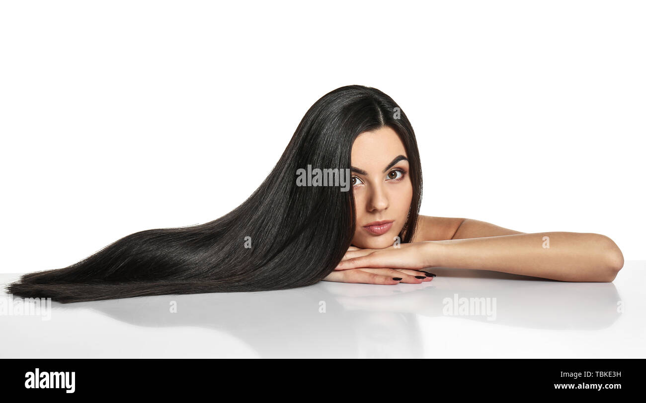 Portrait of beautiful young woman with healthy long hair on white ...