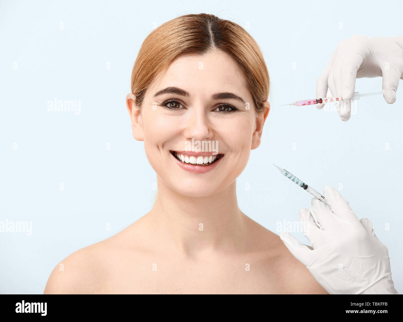 Beautiful woman and hands holding syringes for anti-aging injections on ...