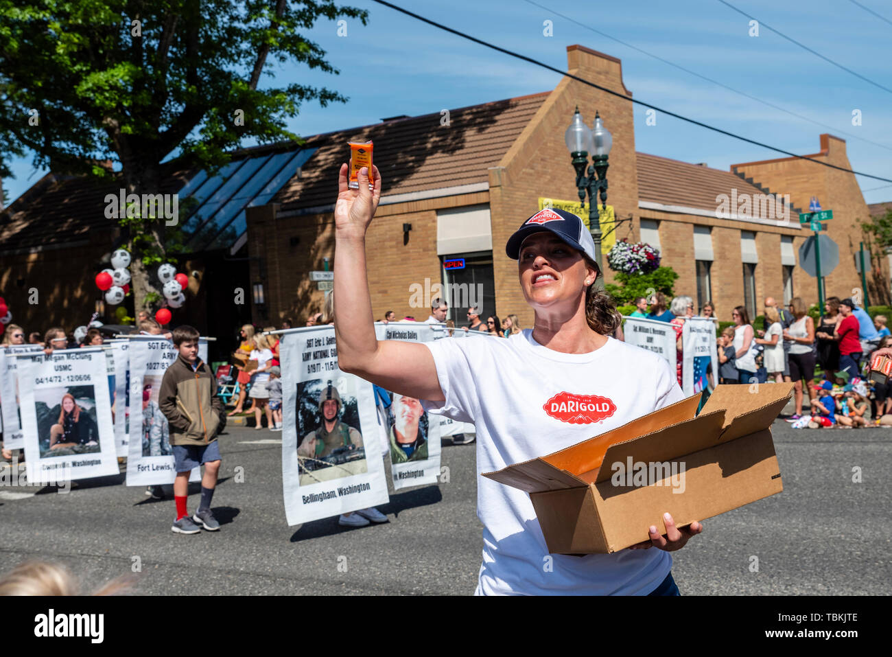 Darigold employees pass out cheese at the Lynden Farmers Day Parade