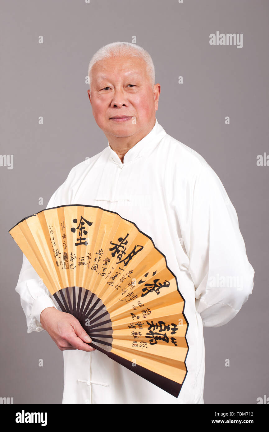 An old man in a traditional costume. Stock Photo