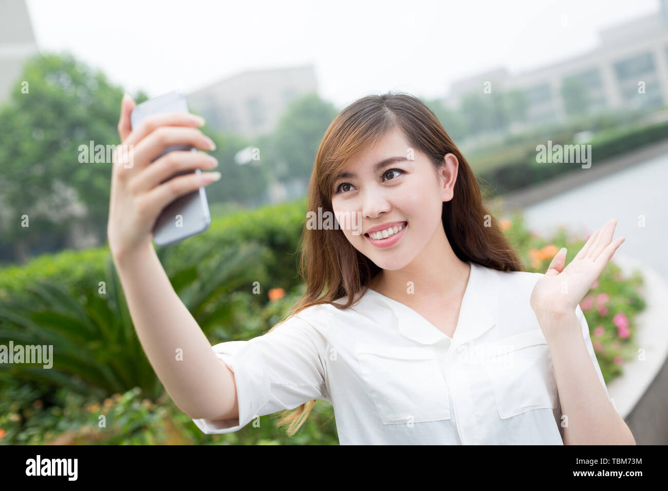 asian beautiful young woman using mobile phone to take selfie ou Stock ...
