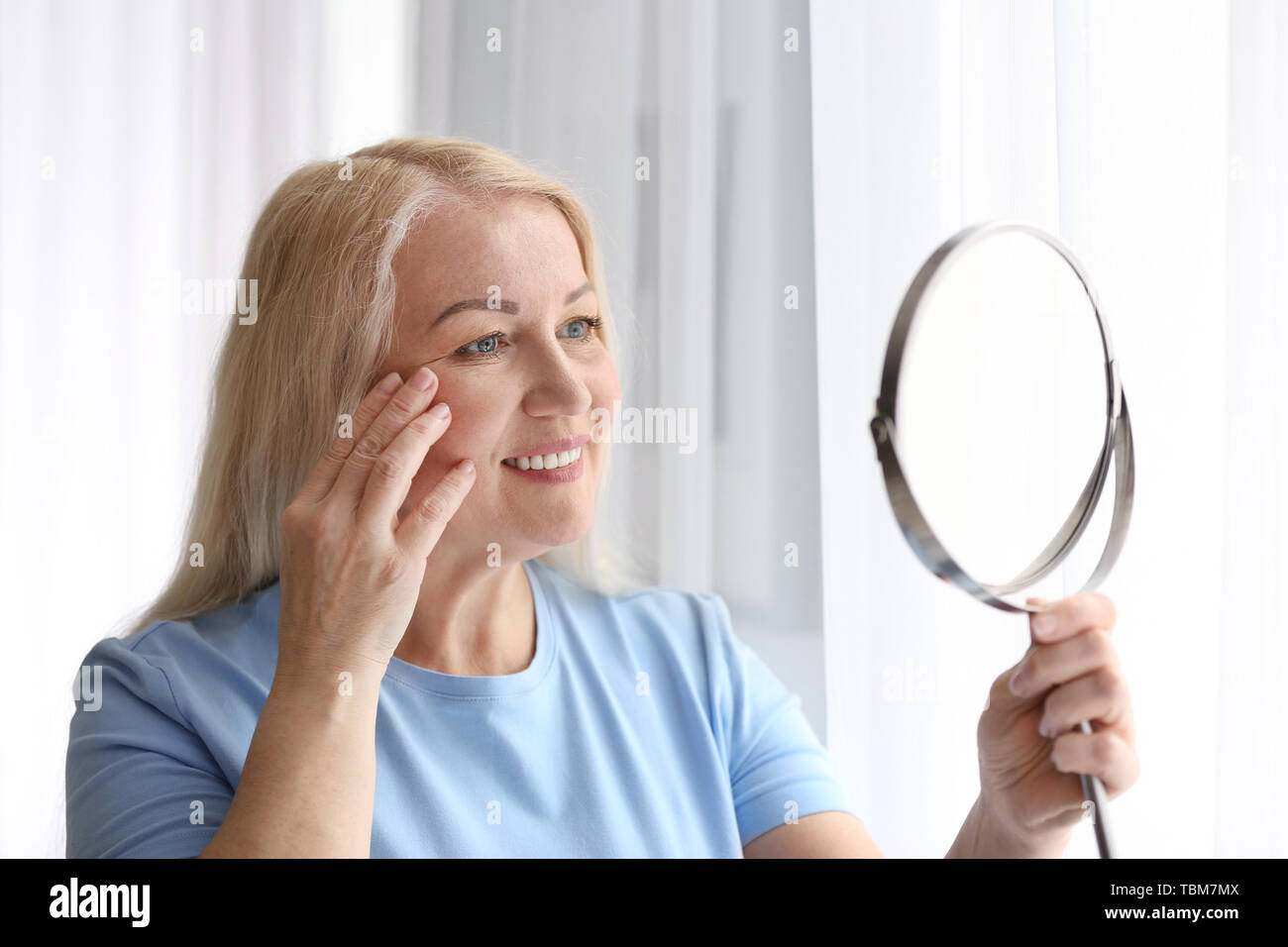 Woman middle age face skin mirror hi-res stock photography and images ...