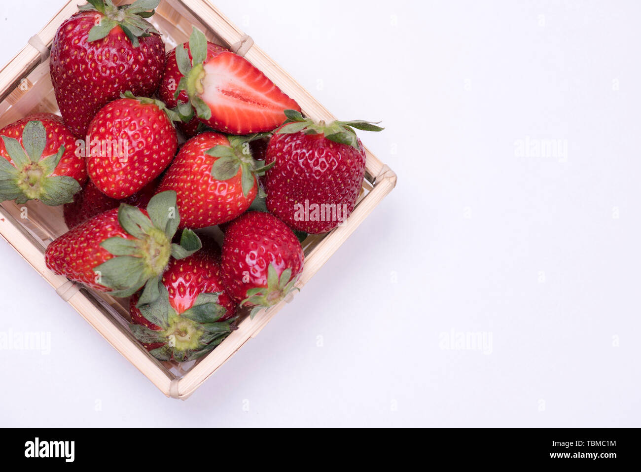 Red strawberry closeup on white background Stock Photo - Alamy