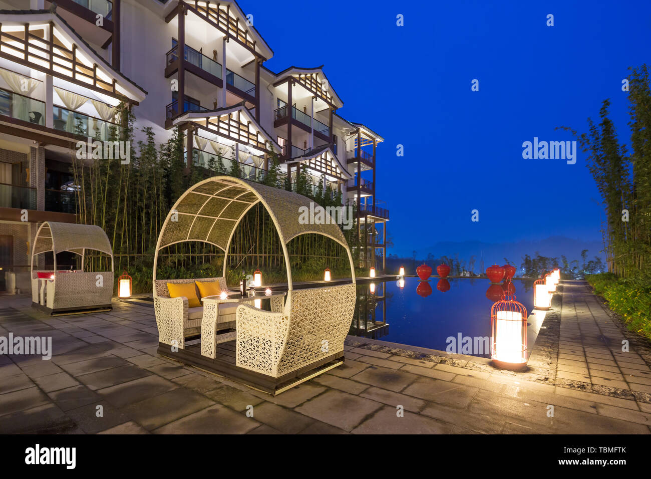 rocking chair on ground front of architecture Stock Photo Alamy